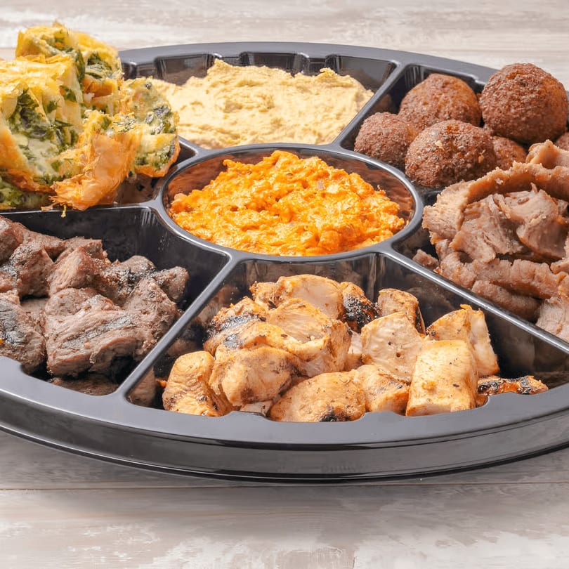 Daphne's Greek Cafe catering platter with falafel, hummus, spanakopita, gyro meat, chicken, and beef.